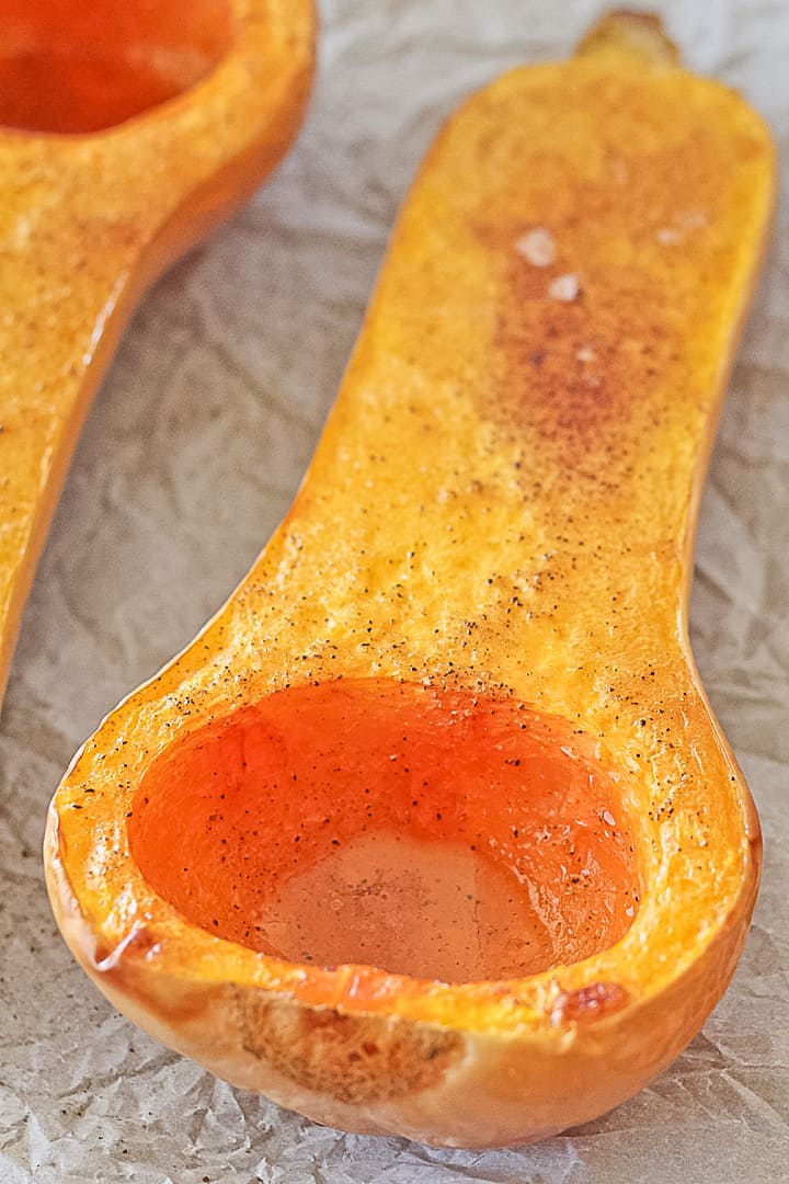 Oven roasted butternut squash cut in half seasoned with salt and pepper.