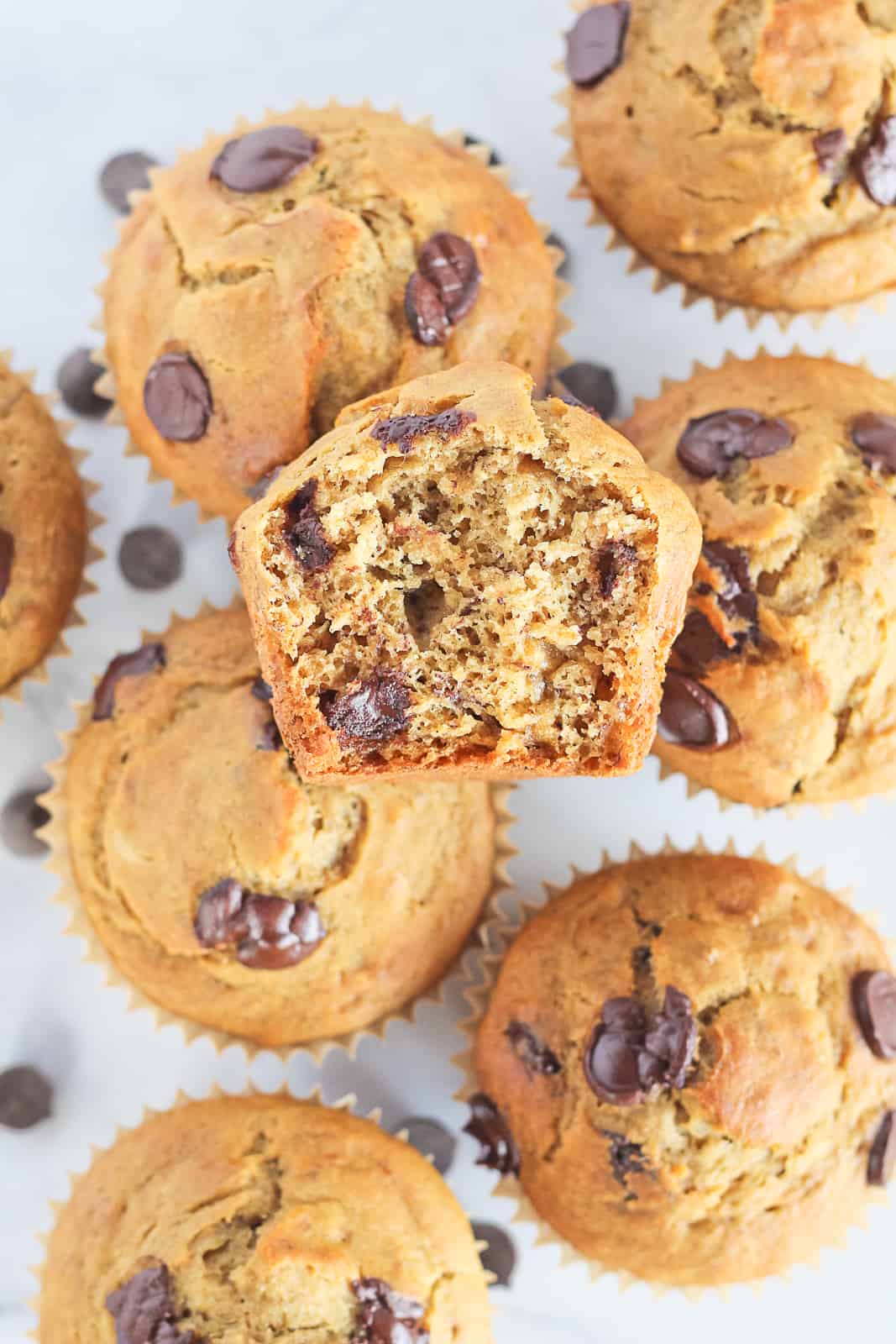 Bite out of a chocolate chip muffin.