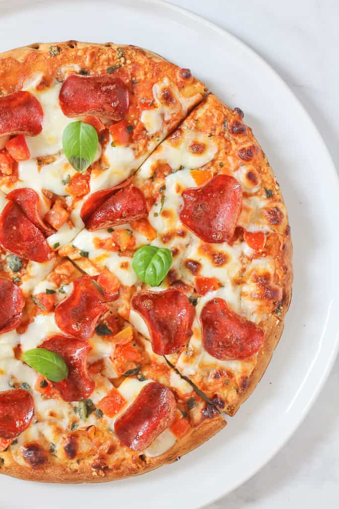 Air Fryer Frozen Pizza Finished with Salt