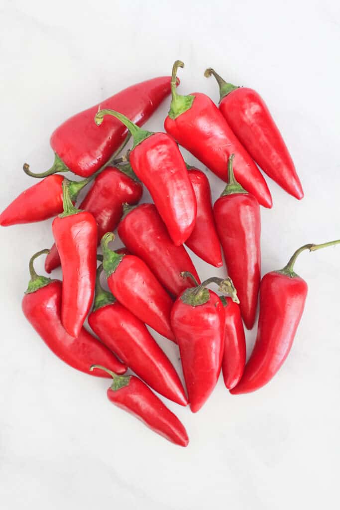 Pile of whole red Fresno Hot Chili Peppers.