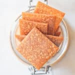 Top view of a container holding sourdough crackers.