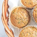 Zucchini muffins in a wicker basket.