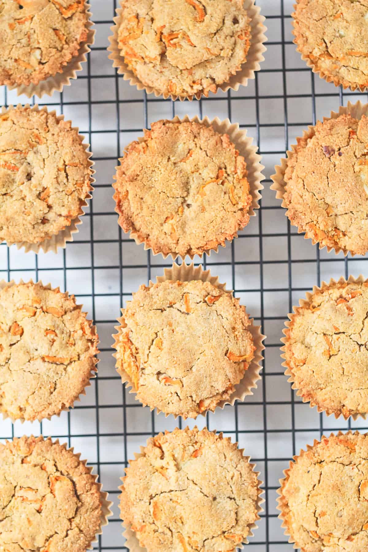 Carrot Cake Muffins cooling on a wire rack.