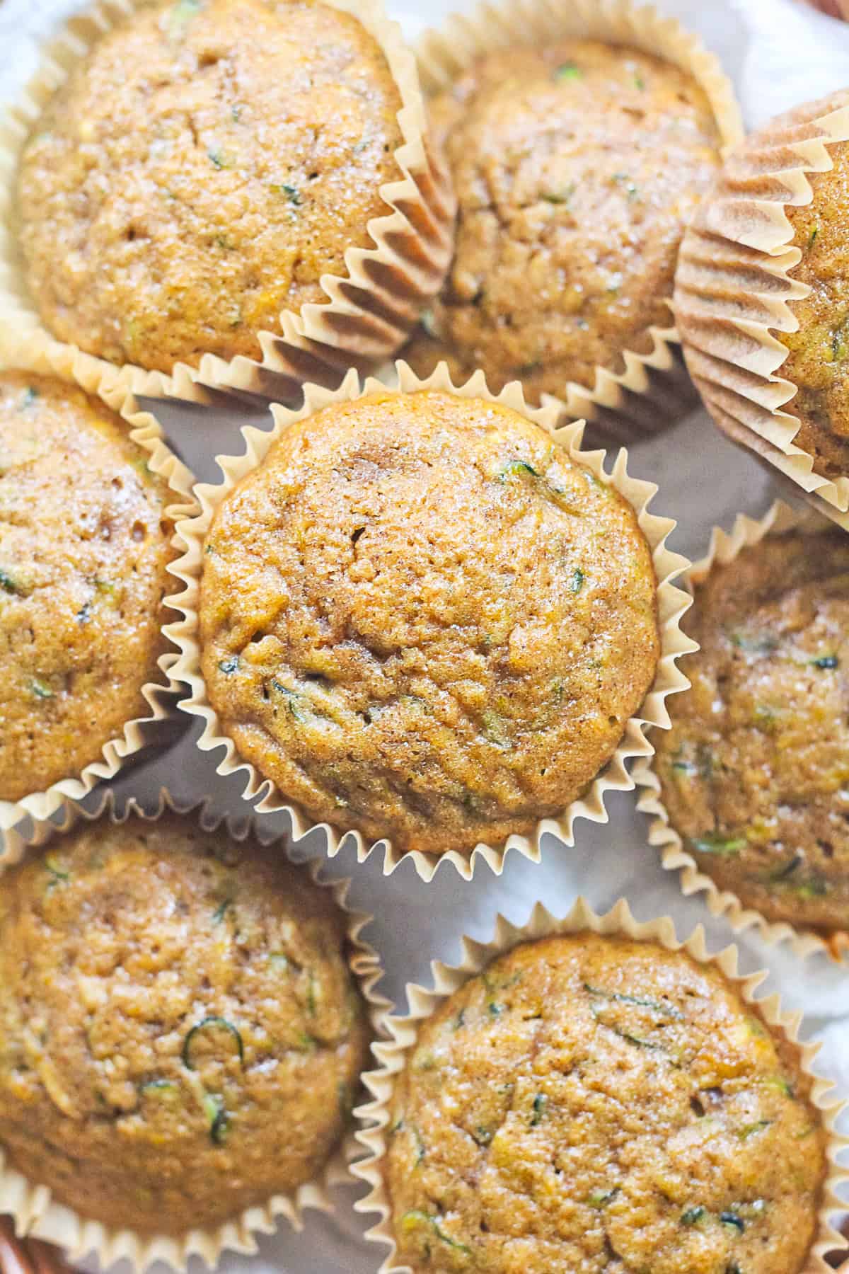 Zucchini bread muffins in parchment paper.