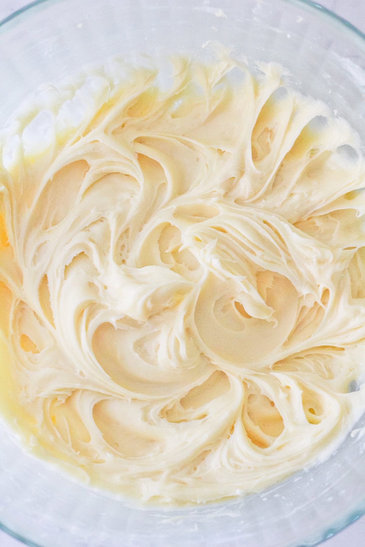 Whipped cream cheese frosting in a bowl.